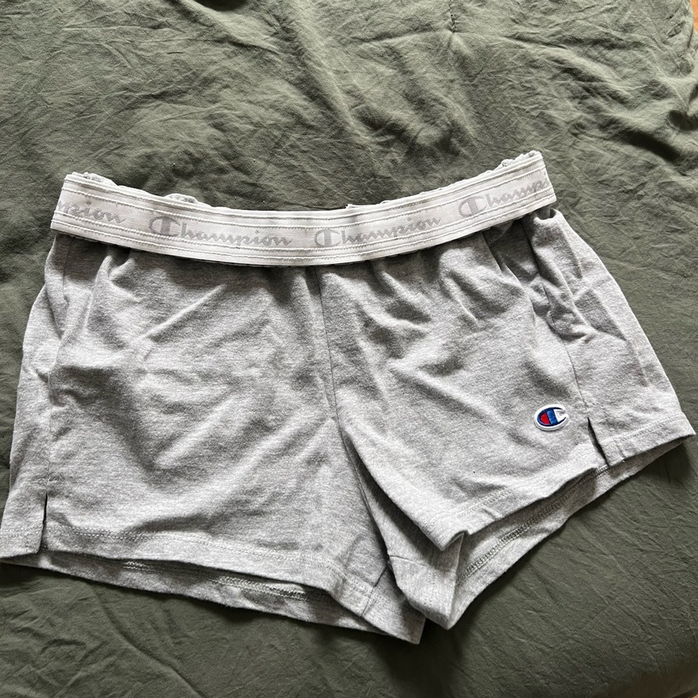 Size medium champion shorts with gold over waistband, never worn